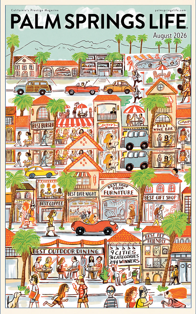 August 2026 cover of PALM SPRINGS LIFE, showing a busy street scene with storefronts, cars, palm trees, people, and small signs in a retro cartoon style.